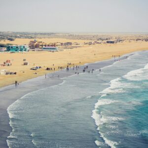 Stunning aerial view of Kund Malir Beach in Balochistan, featuring golden sands and vibrant blue sea.